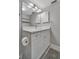 White vanity with quartz countertop, white cabinets at 144 Wild Palm Dr, Bradenton, FL 34210