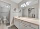 Clean bathroom with single sink vanity, shower, and linen closet at 144 Wild Palm Dr, Bradenton, FL 34210