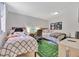 Second bedroom with twin beds, and a football field rug at 144 Wild Palm Dr, Bradenton, FL 34210