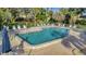 Inviting community pool with plenty of lounge chairs at 144 Wild Palm Dr, Bradenton, FL 34210