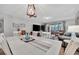 Spacious dining area with white table and chairs, great for entertaining at 144 Wild Palm Dr, Bradenton, FL 34210