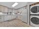 Updated kitchen with white cabinets, granite counters, and tile floors at 144 Wild Palm Dr, Bradenton, FL 34210