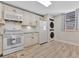 Updated kitchen featuring white cabinets and granite countertops at 144 Wild Palm Dr, Bradenton, FL 34210