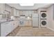 Updated kitchen with white cabinets, granite counters, and tile floors at 144 Wild Palm Dr, Bradenton, FL 34210