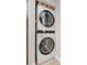 Stackable LG washer and dryer in a well-lit laundry closet at 144 Wild Palm Dr, Bradenton, FL 34210