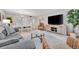 Bright living room features comfortable seating, large TV, and dining area at 144 Wild Palm Dr, Bradenton, FL 34210