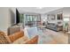 Comfortable living room featuring gray sofa and wicker armchairs at 144 Wild Palm Dr, Bradenton, FL 34210