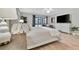 Main bedroom with king-size bed, access to patio, and lots of natural light at 144 Wild Palm Dr, Bradenton, FL 34210