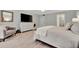 Main bedroom with king bed, plenty of light, and private access to the bathroom at 144 Wild Palm Dr, Bradenton, FL 34210