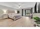 Main bedroom with king-size bed, access to patio, and lots of natural light at 144 Wild Palm Dr, Bradenton, FL 34210