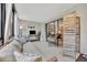 Sunroom with wicker furniture and sliding doors at 144 Wild Palm Dr, Bradenton, FL 34210