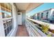 Private balcony overlooking parking lot and other buildings at 1552 Stickney Point Rd # 403, Sarasota, FL 34231