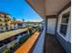 Balcony with water view and partial view of neighboring buildings at 1552 Stickney Point Rd # 403, Sarasota, FL 34231