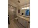 Clean bathroom with granite countertop and shower at 1552 Stickney Point Rd # 403, Sarasota, FL 34231