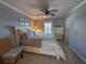 Bright bedroom with a queen-size bed and dresser at 1552 Stickney Point Rd # 403, Sarasota, FL 34231