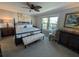 Spacious bedroom with a king-size bed and large windows at 1552 Stickney Point Rd # 403, Sarasota, FL 34231
