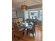 Bright dining area with glass table and wicker chairs at 1552 Stickney Point Rd # 403, Sarasota, FL 34231