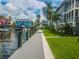 Wooden walkway along the water with green grass at 1552 Stickney Point Rd # 403, Sarasota, FL 34231