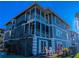 Gray building with spiral staircase and waterfront view at 1552 Stickney Point Rd # 403, Sarasota, FL 34231