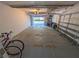 Garage with storage shelving and space for bikes at 1552 Stickney Point Rd # 403, Sarasota, FL 34231