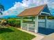 White gazebo on the dock overlooking the water at 1552 Stickney Point Rd # 403, Sarasota, FL 34231