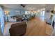 Spacious living room with hardwood floors, sectional sofa, and fireplace at 1552 Stickney Point Rd # 403, Sarasota, FL 34231