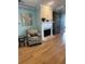Cozy living room featuring a fireplace and hardwood floors at 1552 Stickney Point Rd # 403, Sarasota, FL 34231