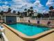 Inviting community pool with lounge chairs at 1552 Stickney Point Rd # 403, Sarasota, FL 34231
