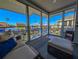 Relaxing sunroom with water views and comfy seating at 1552 Stickney Point Rd # 403, Sarasota, FL 34231