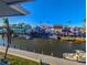 Canal view with colorful buildings and boats at 1552 Stickney Point Rd # 403, Sarasota, FL 34231