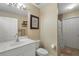 Clean bathroom with a toilet, sink, and shower at 1577 Taggard Rd, North Port, FL 34288