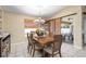 Bright dining room features a wood table with six chairs, and access to a screened patio at 1577 Taggard Rd, North Port, FL 34288