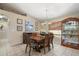Dining area with wood table, chandelier and built-in hutch at 1577 Taggard Rd, North Port, FL 34288