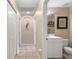 Hallway with built-in shelving and access to bathroom at 1577 Taggard Rd, North Port, FL 34288