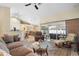 Open living space with sectional sofa and view of dining area at 1577 Taggard Rd, North Port, FL 34288