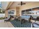 Screened patio with seating and access to pool at 1577 Taggard Rd, North Port, FL 34288