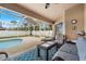Relaxing screened-in pool area with patio furniture at 1577 Taggard Rd, North Port, FL 34288
