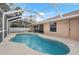 Screened-in pool and patio area at 1577 Taggard Rd, North Port, FL 34288