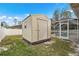 Exterior view of a light beige storage shed at 1577 Taggard Rd, North Port, FL 34288