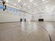 Full-size indoor basketball court with hardwood flooring at 16203 Tradewind Ter, Lakewood Ranch, FL 34211