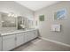 Elegant bathroom boasts double vanity and large mirror at 16203 Tradewind Ter, Lakewood Ranch, FL 34211