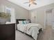 Cozy bedroom with a queen bed and en-suite closet at 16203 Tradewind Ter, Lakewood Ranch, FL 34211