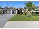 Two-story house with two-car garage and manicured lawn at 16203 Tradewind Ter, Lakewood Ranch, FL 34211