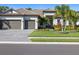 Two-story house with two-car garage and manicured lawn at 16203 Tradewind Ter, Lakewood Ranch, FL 34211