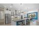 Modern kitchen with stainless steel appliances and large island at 16203 Tradewind Ter, Lakewood Ranch, FL 34211