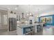 Modern kitchen with stainless steel appliances and large island at 16203 Tradewind Ter, Lakewood Ranch, FL 34211