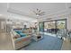 Open floor plan with large sectional sofa and kitchen view at 16203 Tradewind Ter, Lakewood Ranch, FL 34211