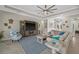 Bright living room features stylish furniture and a large TV at 16203 Tradewind Ter, Lakewood Ranch, FL 34211