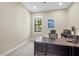 Home office with desk and window overlooking backyard at 16203 Tradewind Ter, Lakewood Ranch, FL 34211