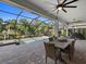 Screened-in patio with pool, table, and chairs at 16203 Tradewind Ter, Lakewood Ranch, FL 34211